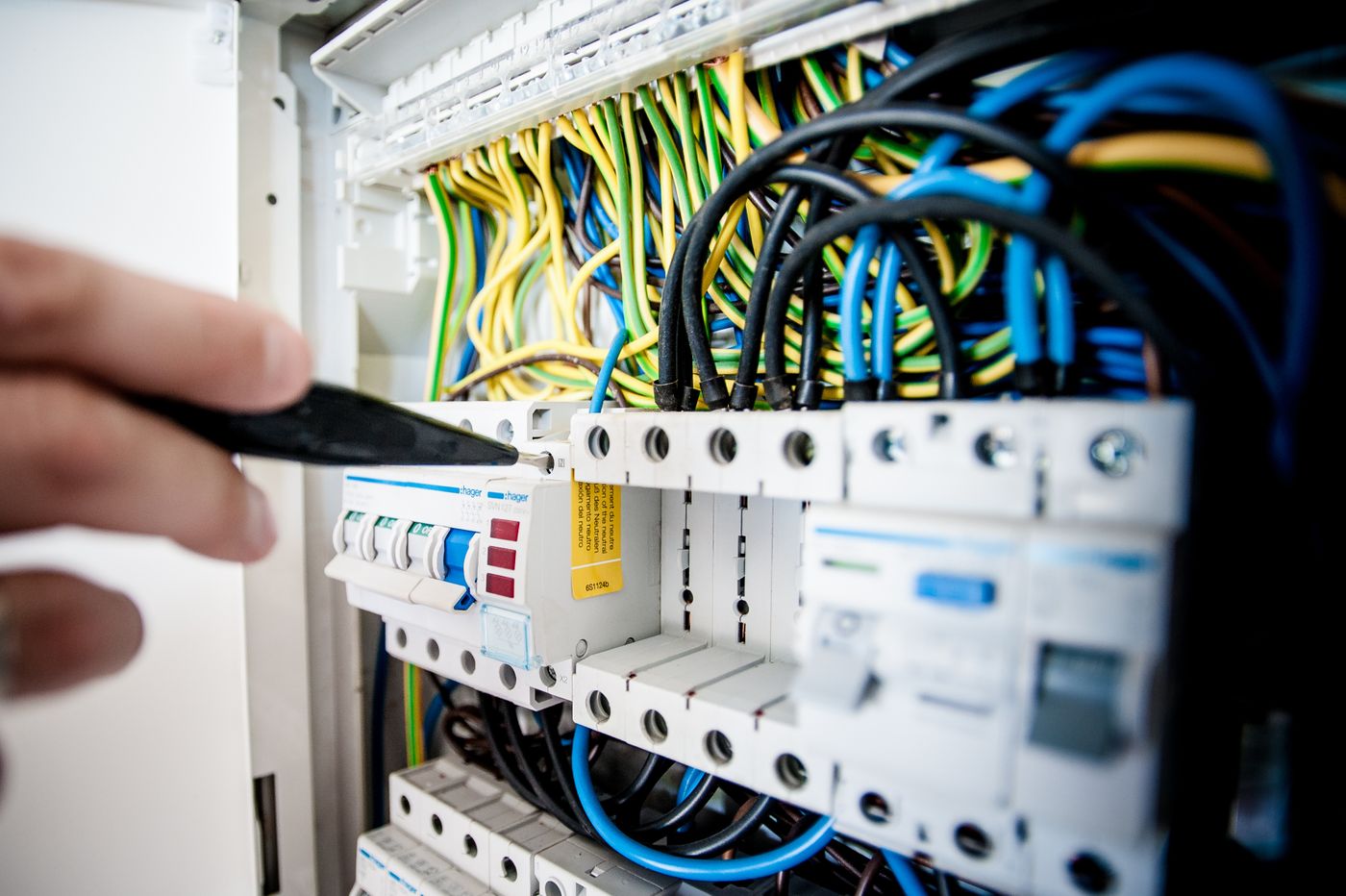 Electrician work on an industrial panel — a trade India-based gulf staffing presents to UAE employers