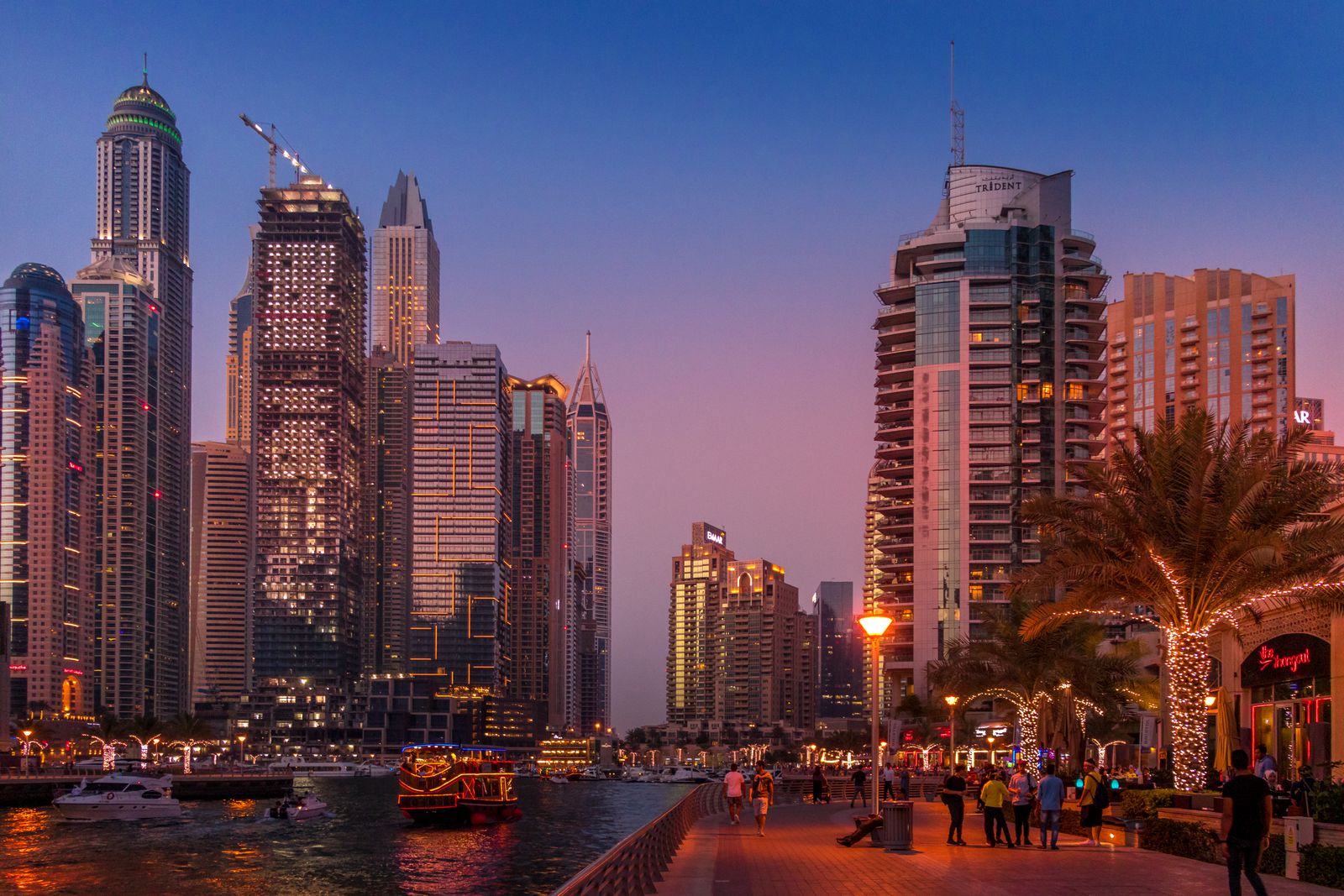 Modern UAE facilities and residential towers of the kind that hire India-based gulf staffing for guards, electricians, and plant operators